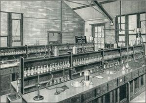 A typical, circa 1901, undergraduate laboratory showing the arrays of glass-stoppered reagent bottles.
