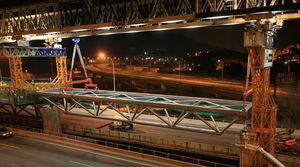 Placing a lattice girder into its final position using the launching gantry.