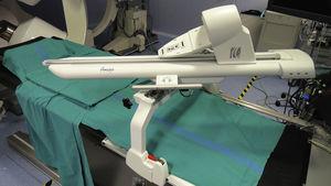 Robotic arm that supports the ablation catheter of the Amigo™ Remote Catheter System. The catheter handle is mounted on the arm and the distal part of the catheter is inserted via the femoral introducer. Movements are transmitted to the catheter through the robotic arm by means of a joystick located in a remote console.