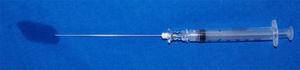Residual volume in a spinal needle after administering spinal anesthesia.